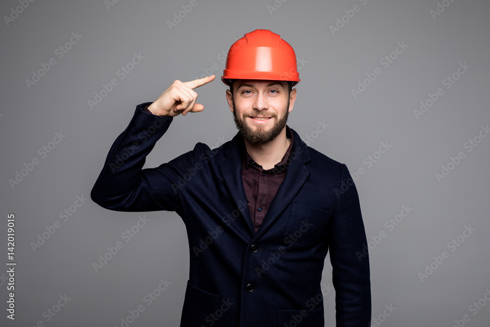Young construction worker pointed on hard hat Young construction worker pointed on hard hat