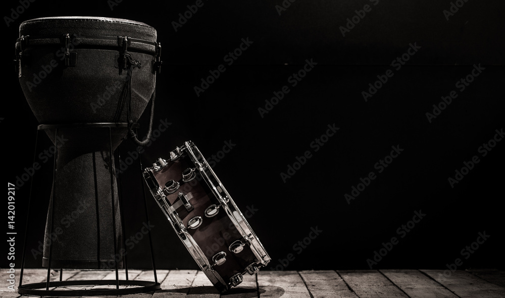 musical percussion instruments on black background drum Bongo and snare musical percussion instruments on black background drum Bongo and snare