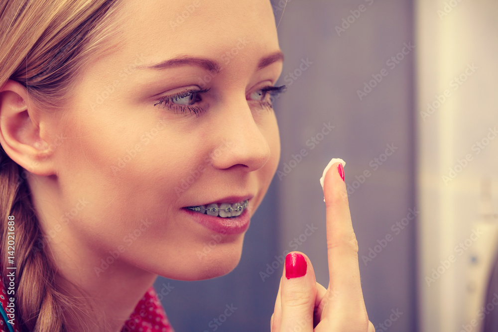 Woman applying moisturizing skin cream. Skincare. Woman applying moisturizing skin cream. Skincare.