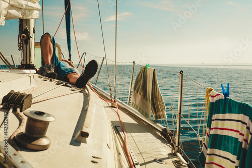 Man relaxing on sport yacht front