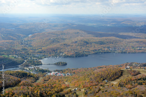 Lake Tremblant and Mont-Tremblant village in fall with fall foliage  from top of Mont Tremblant  Quebec  Canada.