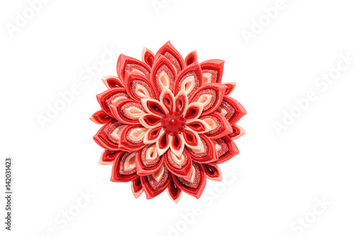 Kanzashi. Red artificial flower isolated on white background