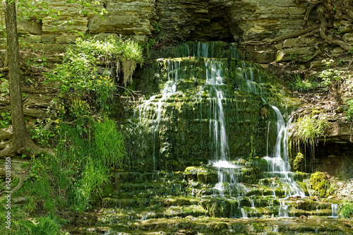 The water tumbles over the Beulah Spring Falls. This mossy waterfall has multiple levels as it cascades from the cliff face. photo
