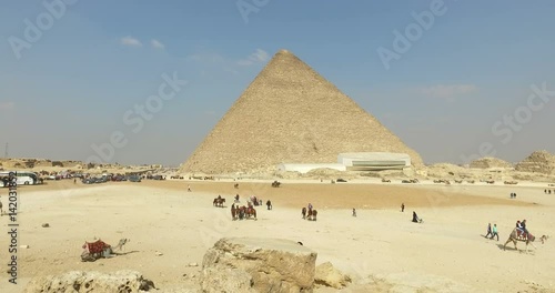 CAIRO, EGYPT - FEBRUARY 04, 2016: View of tourist around Great pyramid of Giza, also known as Pyramid of Khufu or the Pyramid of Cheops