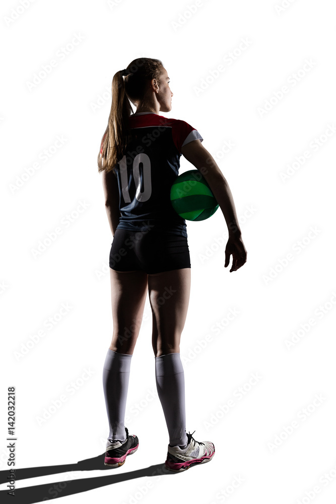 Female volleyball player standing with ball Female volleyball player standing with ball
