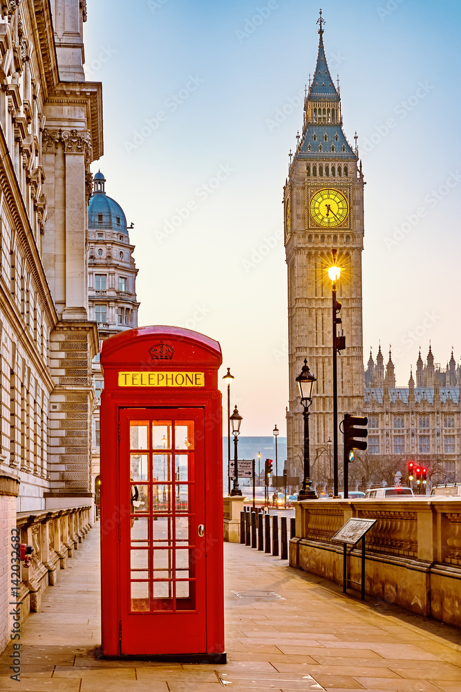 Traditional red phone booth and Big Ben in London