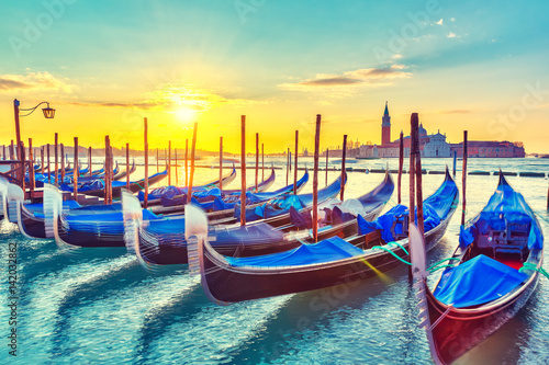 Gondolas in Venice at sunrise photo