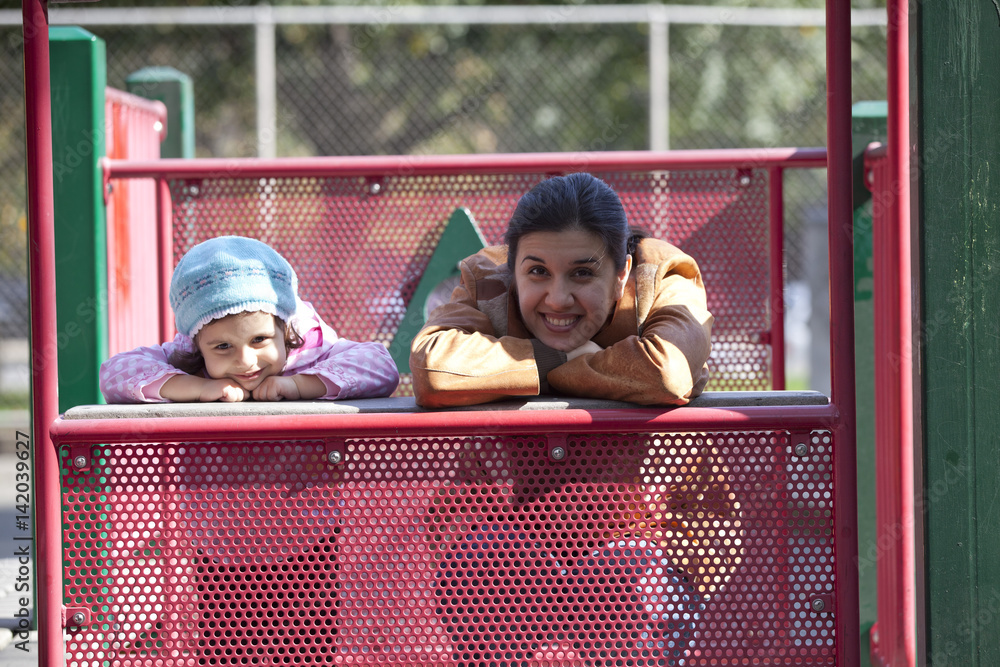 Playful mother and daughter