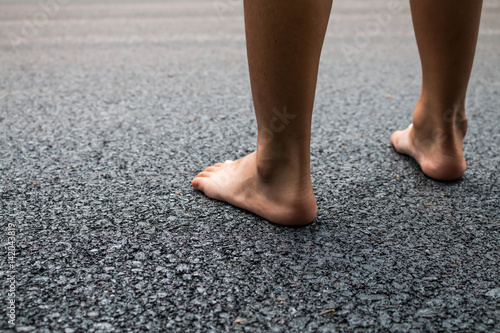 Black asphalt foot on the road close up background.