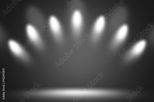 Spotlight white on stage background.