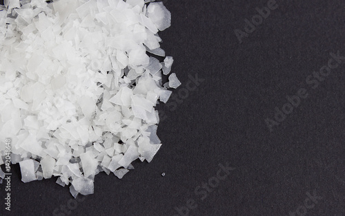 Sea salt flakes, nigari, magnesium chloride,top view photo