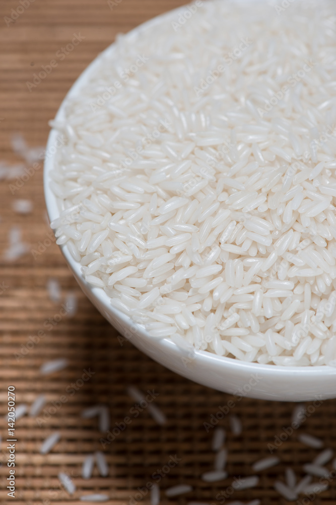 Rice in spoon and bowl. Jasmine Rice, Thai Rice, White Rice. Rice in spoon and bowl. Jasmine Rice, Thai Rice, White Rice.