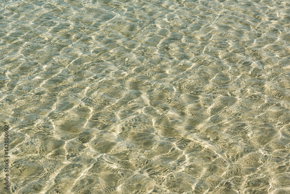 Shallow sea, water texture background. Beautiful white sand, clear turquoise water Shallow sea, water texture background. Beautiful white sand, clear turquoise water