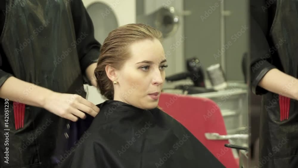 Woman is having haircut in the salon Woman is having haircut in the salon