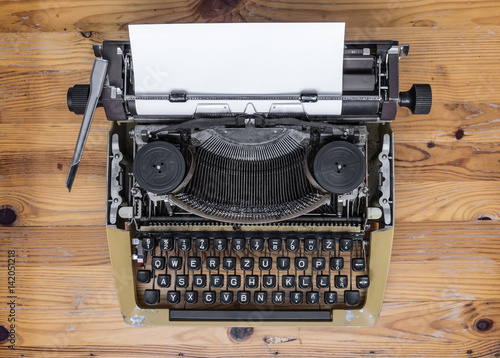 Old typewriter on wooden desk