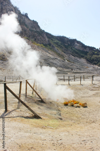 The Solfatara is a shallow volcanic crater with steam with sulfurous fumes, Pozzuoli, Naples, Italy