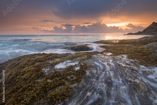 sea waves lash line impact rock on the beach