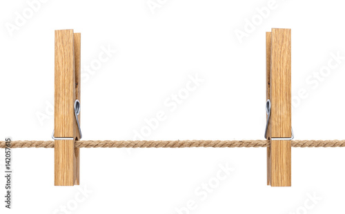 Isolated clothespins. Wooden clothespins on rope isolated on white background with clipping path