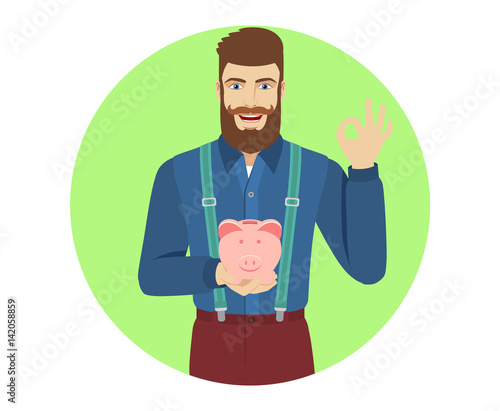 Hipster holding a piggy bank showing a okay hand sign