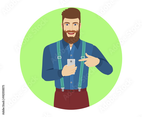 Hipster pointing at a mobile phone in his hand