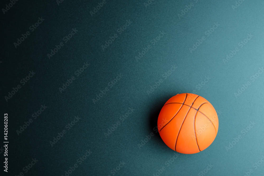 Basketball toy isolated on black background with copy space.Concept winner of the sport.