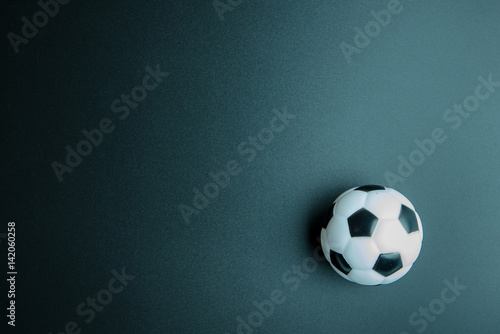 Football toy isolated on black background with copy space.Concept winner of the sport.