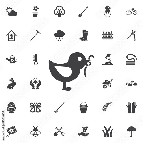 bird eating worm icon