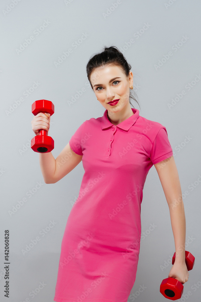Fitness girl fit woman with dumbbells, doing exercise with dumb bells training with weights isolated on white background Fitness girl fit woman with dumbbells, doing exercise with dumb bells training with weights isolated on white background