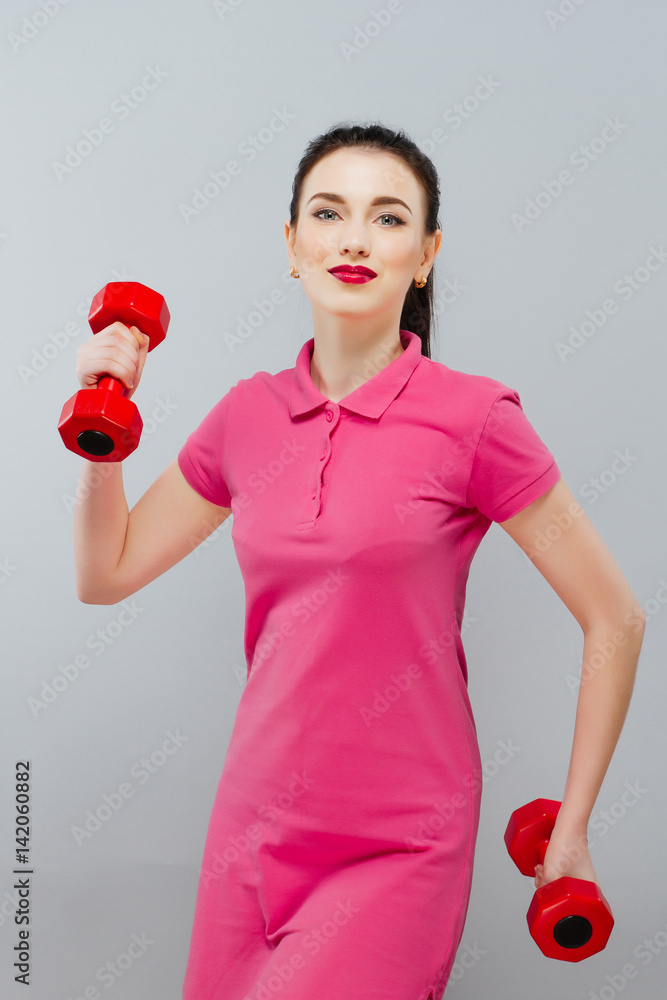 Fitness girl fit woman with dumbbells, doing exercise with dumb bells training with weights isolated on white background Fitness girl fit woman with dumbbells, doing exercise with dumb bells training with weights isolated on white background