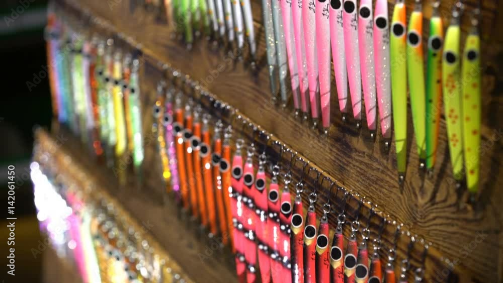 Triple hooks and colorful fishing lures in the sporting goods store. Close up Triple hooks and colorful fishing lures in the sporting goods store. Close up