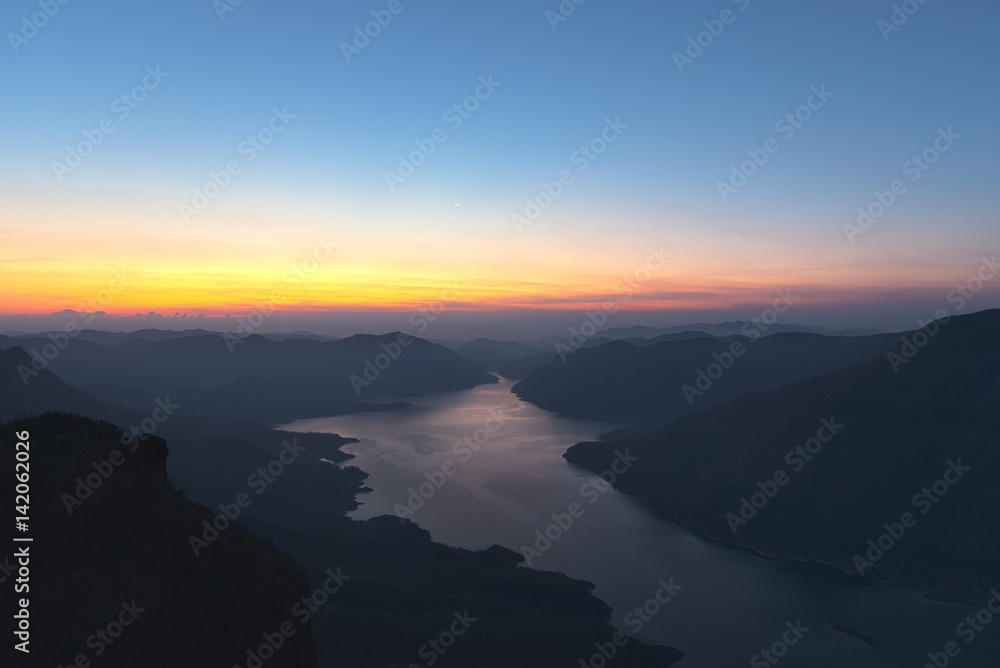 Mae Ping river view point. Sunrise above the lake and mountain.