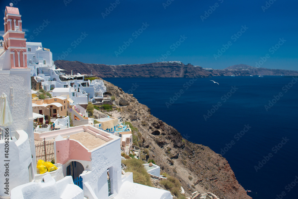 Architecture of island of Santorini, the most romantic island in the world, Greece. Hotels in Santorini. Walking the streets of Fira summer day, Travel to Greece. Beautiful white exterior Santorini 
