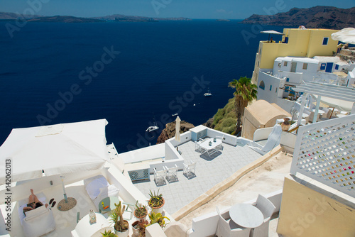 Architecture of island of Santorini, the most romantic island in the world, Greece. Hotels in Santorini. Walking the streets of Fira summer day, Travel to Greece. Beautiful white exterior Santorini 