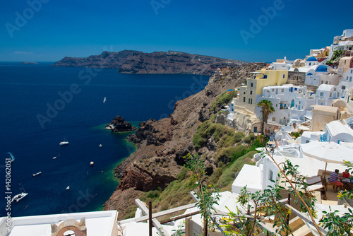 Architecture of island of Santorini, the most romantic island in the world, Greece. Hotels in Santorini. Walking the streets of Fira summer day, Travel to Greece. Beautiful white exterior Santorini 