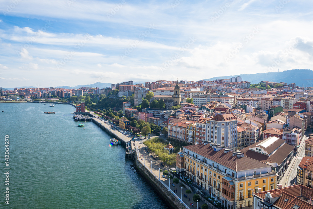 The Estuary of Bilbao with the town Portugalete to the right, as seen from the bridge looking south. The Vizcaya Bridge is the worlds oldest transporter bridge, built in 1893