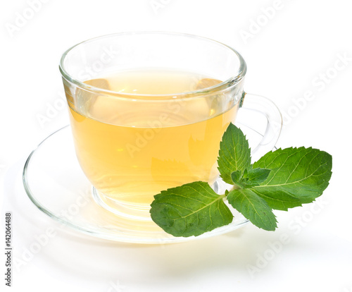 Green tea in transparent cup with mint leaves isolated on white