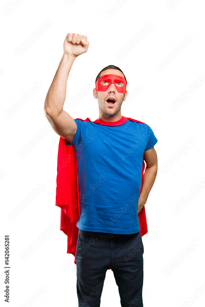 Astonished superhero with a fly gesture Astonished superhero with a fly gesture