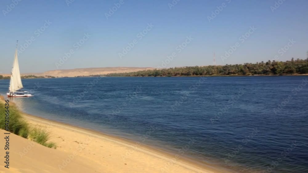 Felucca, traditional wooden sailboat on shore of Nile, Egypt. Felucca, traditional wooden sailboat on shore of Nile, Egypt.