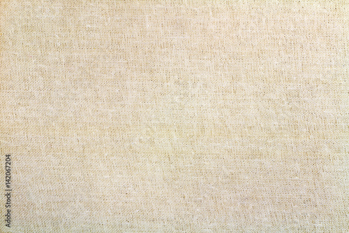 Vintage beige textile texture closeup. Abstract background
