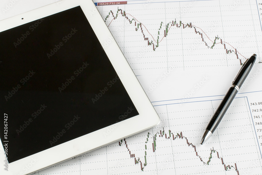 Tablet computer, Blueprints and silver-black pen on a white background, business concept. Tablet computer, Blueprints and silver-black pen on a white background, business concept.