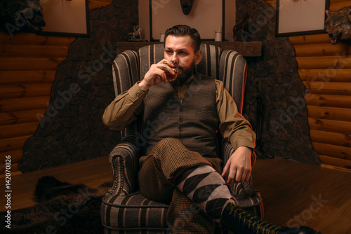 Photography Hunter man drink alcohol after successful hunt