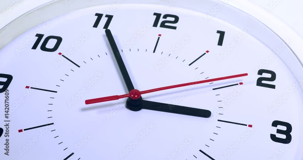 Macro shot of white clock with five minutes left to 3. Professional shot in 4K resolution. Macro shot of white clock with five minutes left to 3. Professional shot in 4K resolution.