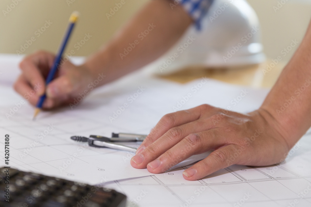 Naklejka premium Architect or engineer working with blueprints and compass in office, Construction concept.