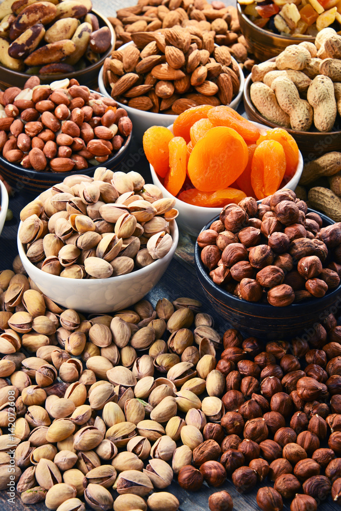 Naklejka premium Composition with dried fruits and assorted nuts