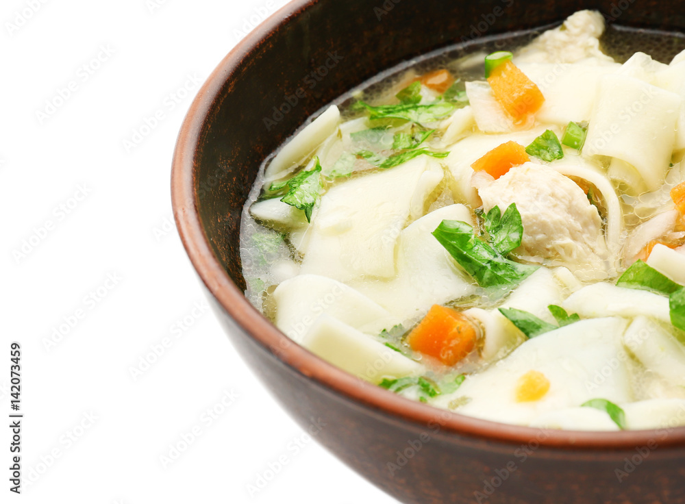 Chicken noodle soup in bowl on white background Chicken noodle soup in bowl on white background