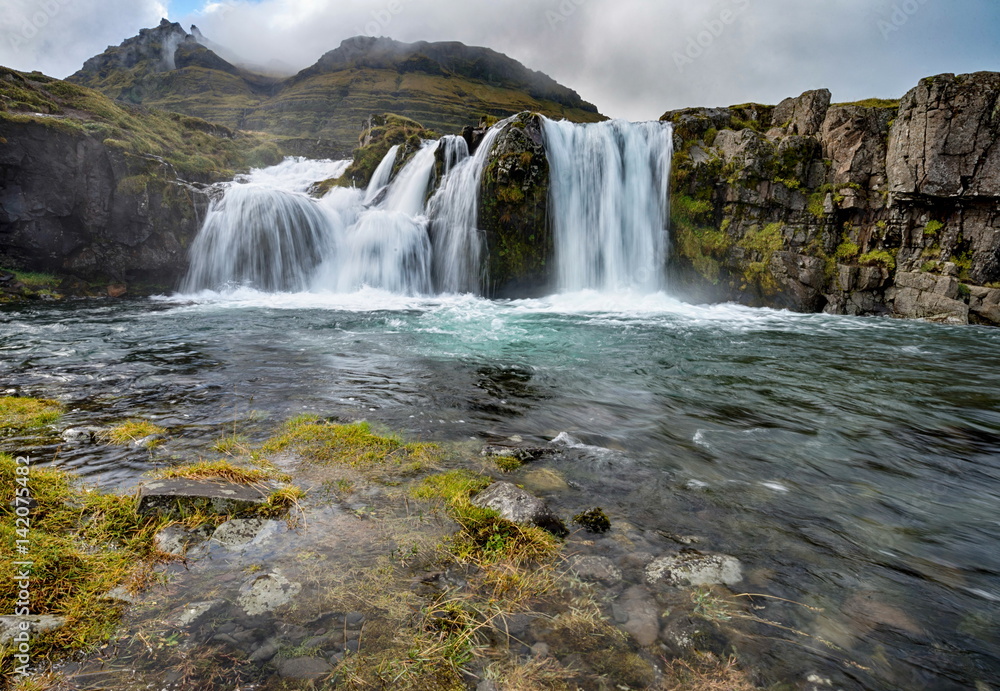 Kirkjufellsfoss waterfall in Iceland Kirkjufellsfoss waterfall in Iceland
