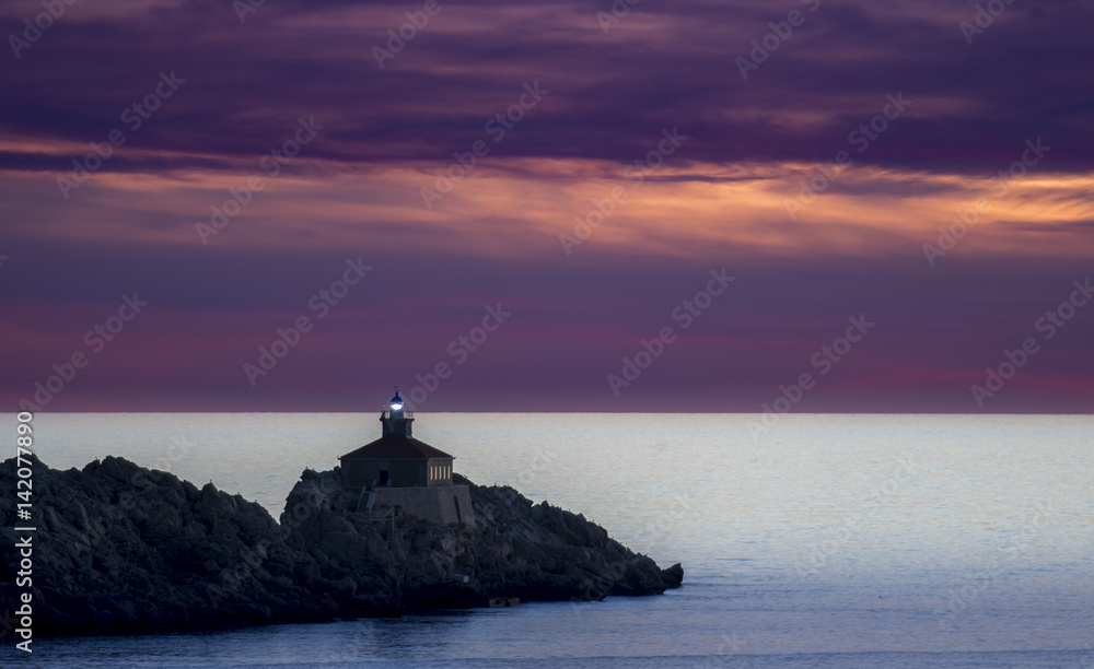 Lighthouse in sunset; island Grebeni, Dubrovnik, Croatia