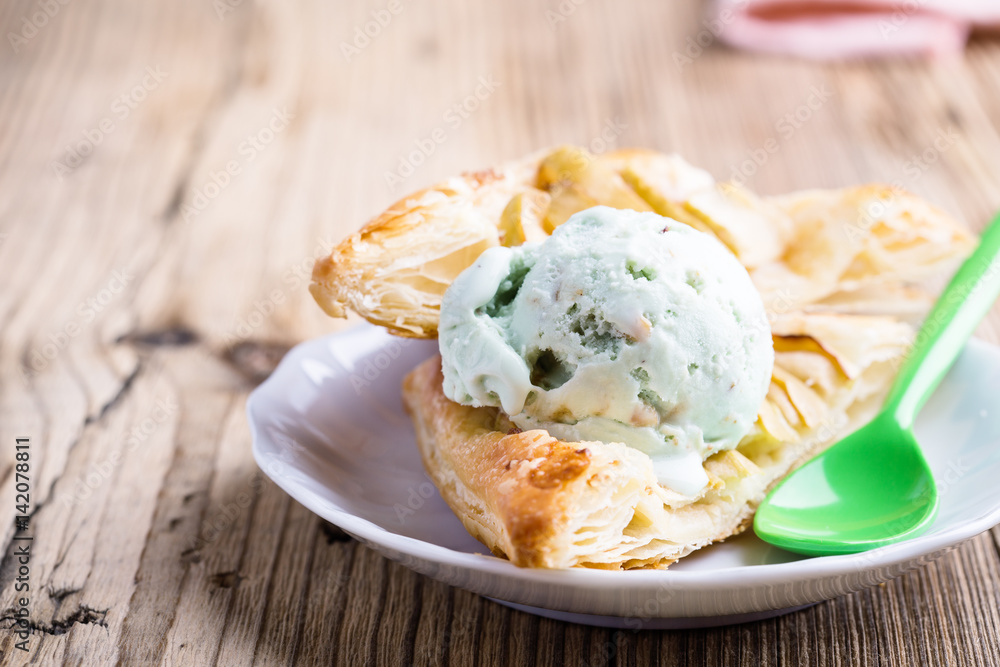 Sliced homemade apple tart with ice cream Sliced homemade apple tart with ice cream