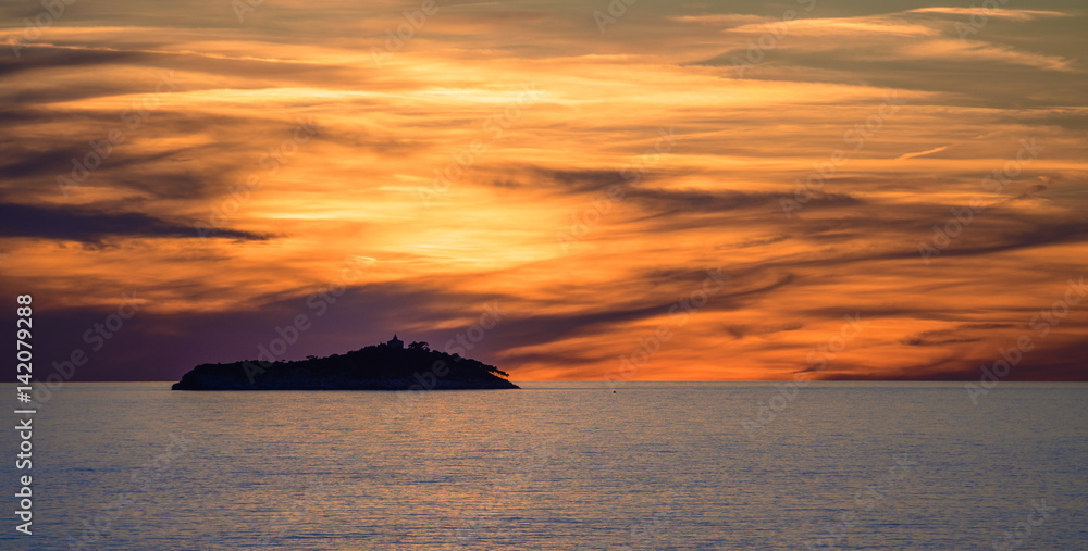 Sunset over Sveti Andrija island near Dubrovnik, Croatia
