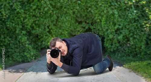 Male squat, photographing on digital camera